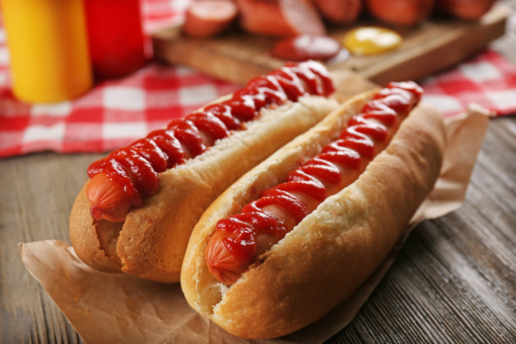 hot dogs wooden background closeup 89614257 AfNi9A