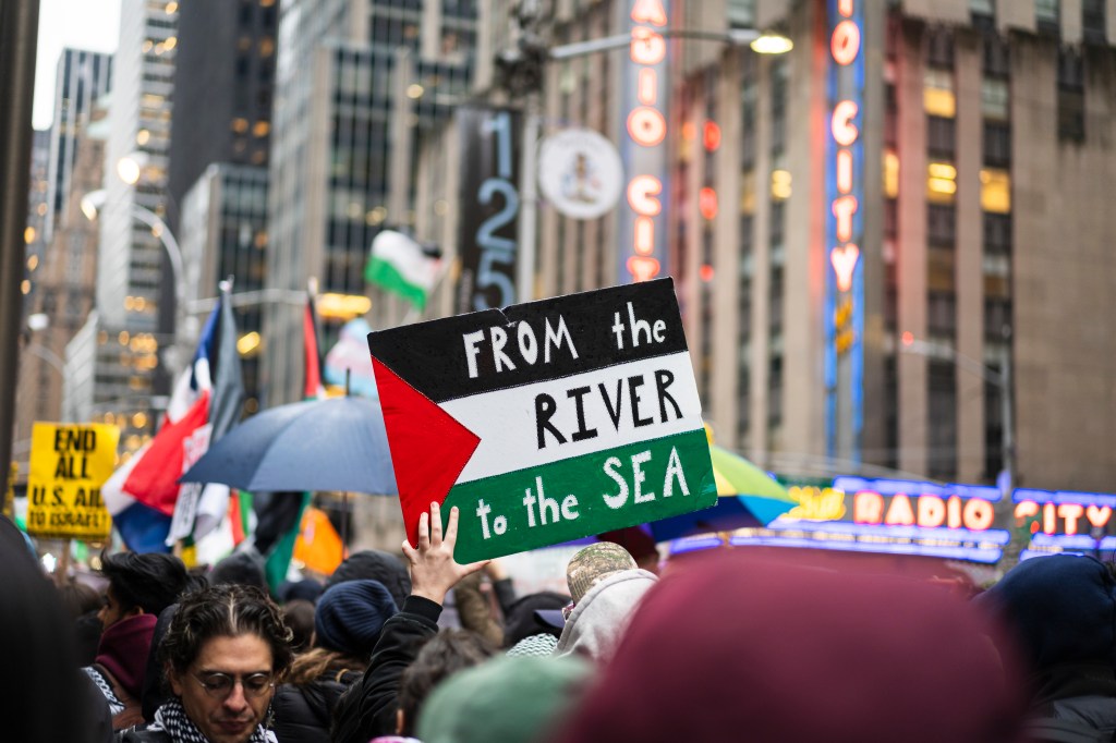 protestor pictured holding sign reads 79161243 a4ce05 zW10WG