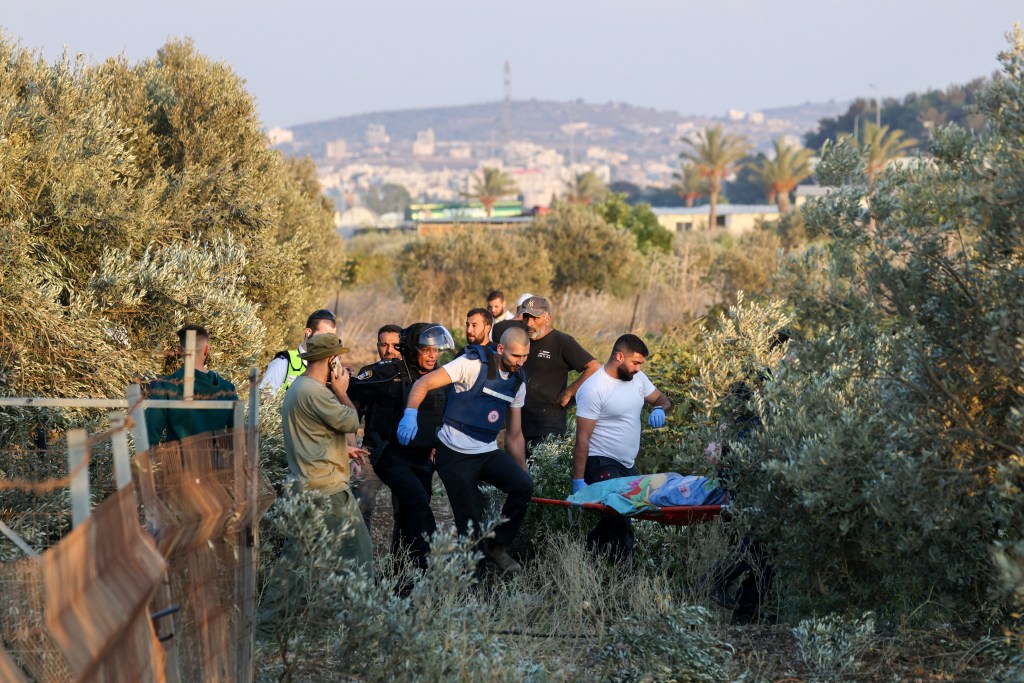 first responders carry shrouded body 92764597