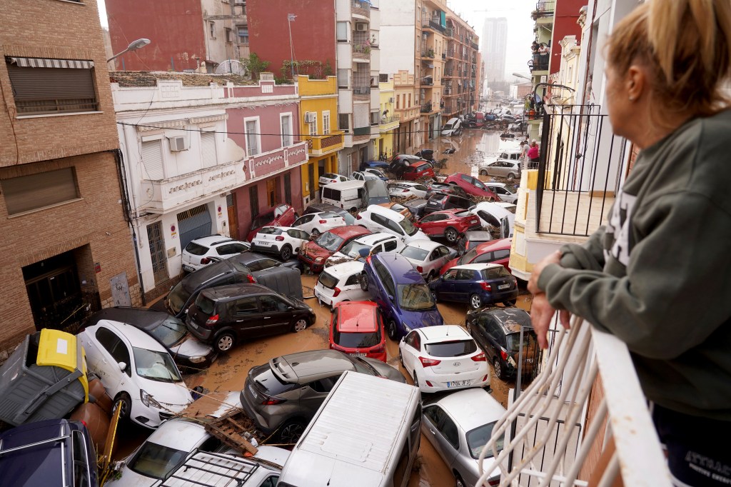 woman looks balcony vehicles trapped 92688513 bLj3Pc